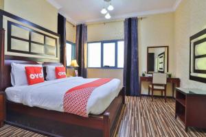 Postel nebo postele na pokoji v ubytování Grand PJ Hotel