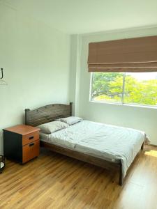 Postel nebo postele na pokoji v ubytování Anna温馨公寓式的住宅
