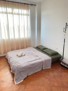 Ένα ή περισσότερα κρεβάτια σε δωμάτιο στο Anna温馨公寓式的住宅