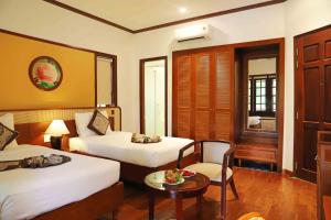 Giường trong phòng chung tại Sunny Beach Resort & Spa