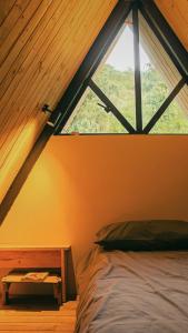 Ein Bett oder Betten in einem Zimmer der Unterkunft Ecolodge Cuentos de Agua