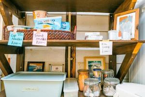 a shelf with a toilet and other items on it at Haryugetu Guesthouse in NASA in Kaiyo