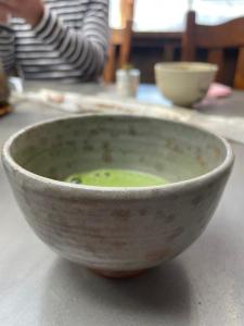 a bowl of soup sitting on a table at Haryugetu Guesthouse in NASA in Kaiyo