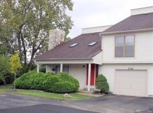 a white house with a white garage at The Cozy Townhouse WPAFB & WSU in Fairborn