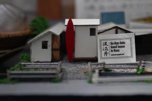 a model of a small house with a red ribbon at Haryugetu Guesthouse in NASA in Kaiyo