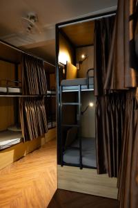 a room with two bunk beds in it at Covent Garden Hotel in Ho Chi Minh City