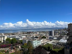 a view of a city with the ocean in the background at Great bay views in Russian Hill district in San Francisco