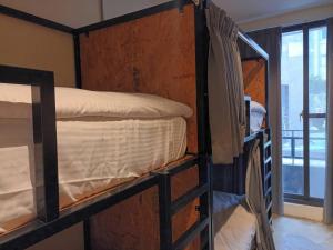 薇薇青旅-嚞驫驛站にあるベッド