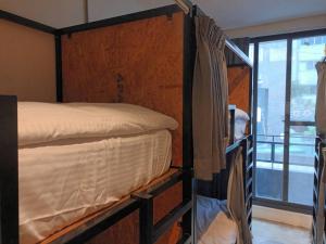 薇薇青旅-嚞驫驛站にあるベッド