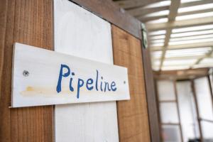 a sign on a wall that reads pipeline at Haryugetu Guesthouse in NASA in Kaiyo