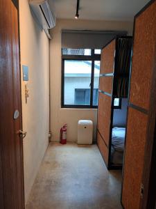 薇薇青旅-嚞驫驛站にあるベッド