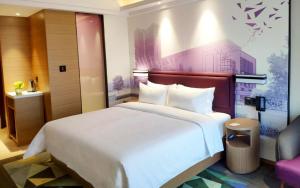 Letto o letti in una camera di Hampton by Hilton Zhuhai Cheng Feng Plaza