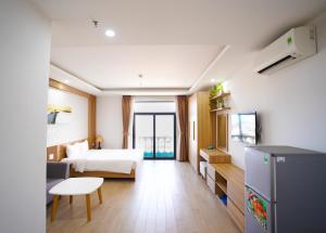 Postel nebo postele na pokoji v ubytování An Dương Hotel & Apartment + 37 fotografií