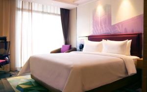 Letto o letti in una camera di Hampton by Hilton Zhuhai Cheng Feng Plaza