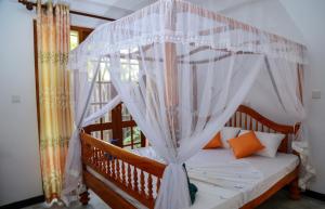 A bed or beds in a room at Cinnamon City