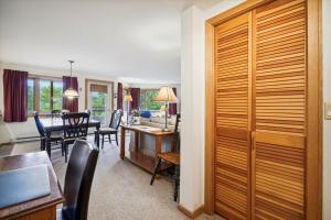 a living room and dining room with a dining table at Incredible Highridge 2 bedroom 2 bathroom with Indoor Pool A14 in Killington