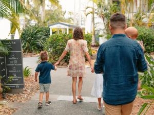 a family walking across a crosswalk at Mercure Gold Coast Resort in Gold Coast