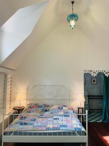 a bedroom with a bed in a attic at The Backyard 28 in Khlong Toei