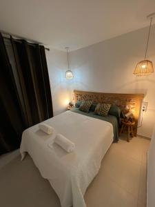 Almadrava Paradise et Eden客房内的一张或多张床位