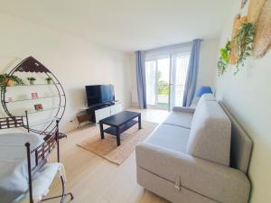 Posezení v ubytování Élégant apt avec vue Tour Eiffel & parking privé
