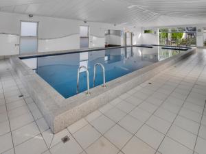 a large swimming pool in a large building at BIG4 Ingenia Holidays Queenscliff Beacon in Queenscliff