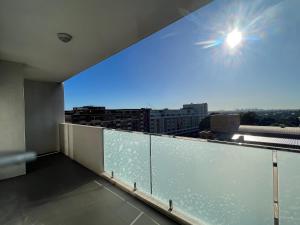 a balcony with a view of the sky at Hurstville New apartment with city view in Sydney