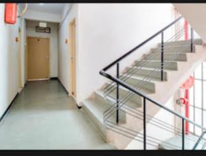 an empty hallway with stairs in a building at Hotel Rahi,Nashik in Nashik