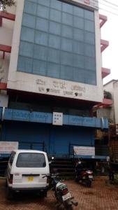 a white van parked in front of a building at Hotel Rahi,Nashik in Nashik