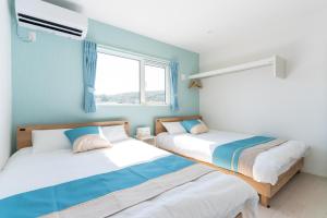 Voodi või voodid majutusasutuse グランディオーソ沖縄プールヴィラ金武2 toas