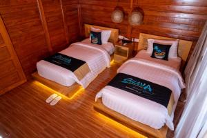 Tempat tidur dalam kamar di Shava Beach Resort