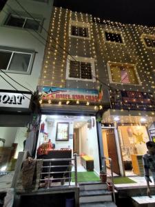 a hotel with a sign on the side of a building at Hotel villa in Ujjain +31 photos