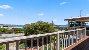a deck with a view of the ocean at Bimbadeen in Coffin Bay