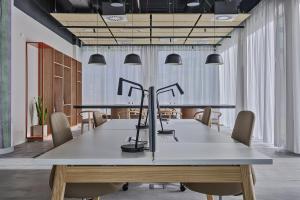 a conference room with a table and chairs at Noli Mokotow in Warsaw