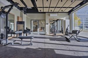 a gym with cardio equipment in a building at Noli Mokotow in Warsaw