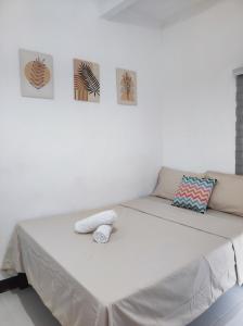 Postel nebo postele na pokoji v ubytování Aloha Hostel Siargao