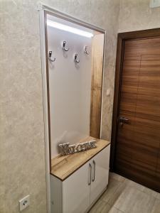 a bathroom with a sink and a mirror at Family Boutique Residence-Free parking in Veliko Tŭrnovo