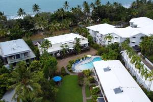 an aerial view of a resort with a swimming pool at Beach Retreat Chic: Poolside on the Esplanade in Port Douglas