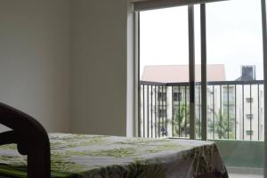 Кровать или кровати в номере Resort Apartment Athurugiriya