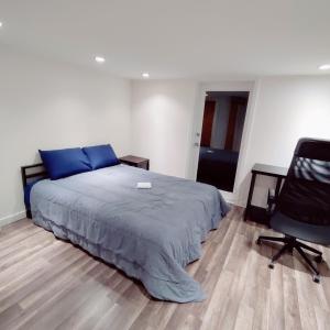 a bedroom with a bed and a desk and a chair at Fancy SF Suite, Prime Location, Near Fishermans Wharf, SF Bay and Financial District in San Francisco