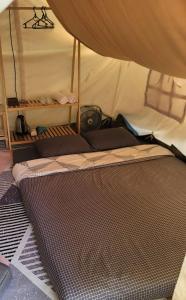 a mattress inside of a tent at Ma Lá Glamping Đà Lạt in Da Lat