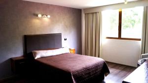 Postel nebo postele na pokoji v ubytování Suites Meson Del Cid