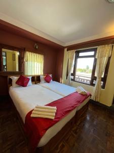 Postel nebo postele na pokoji v ubytování Golden Gate Guest House