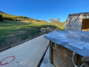 a mattress on the side of a tent with a road at Au Mas du Bec Pointu entre DIOIS et PROVENCE in Eygluy