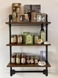 a shelf filled with different types of food at Riverbend Farm in Robertson