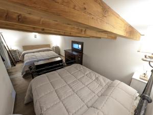 Postel nebo postele na pokoji v ubytování Mansarda con vista panoramica Limone Piemonte + 10 fotografií