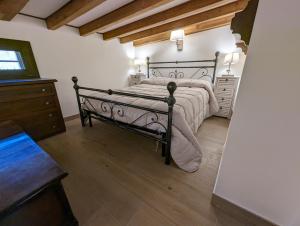 Postel nebo postele na pokoji v ubytování Mansarda con vista panoramica Limone Piemonte