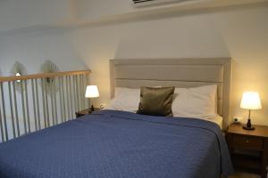 Lova arba lovos apgyvendinimo įstaigoje Mandani Bay Suites Sea Views