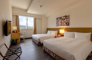 Guide Education Culture Hotel Kaohsiung Museum of Fine Arts客房内的一张或多张床位