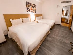Guide Education Culture Hotel Kaohsiung Museum of Fine Arts客房内的一张或多张床位