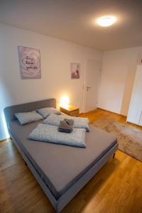 a large bed in a room with at NEW East Side Apartment Innsbruck I Free Parking in Innsbruck
